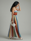 FJØRNA women's summer maxi dress with bold striped pattern, strapless design, flowing fabric, ideal for warm weather and casual wear.