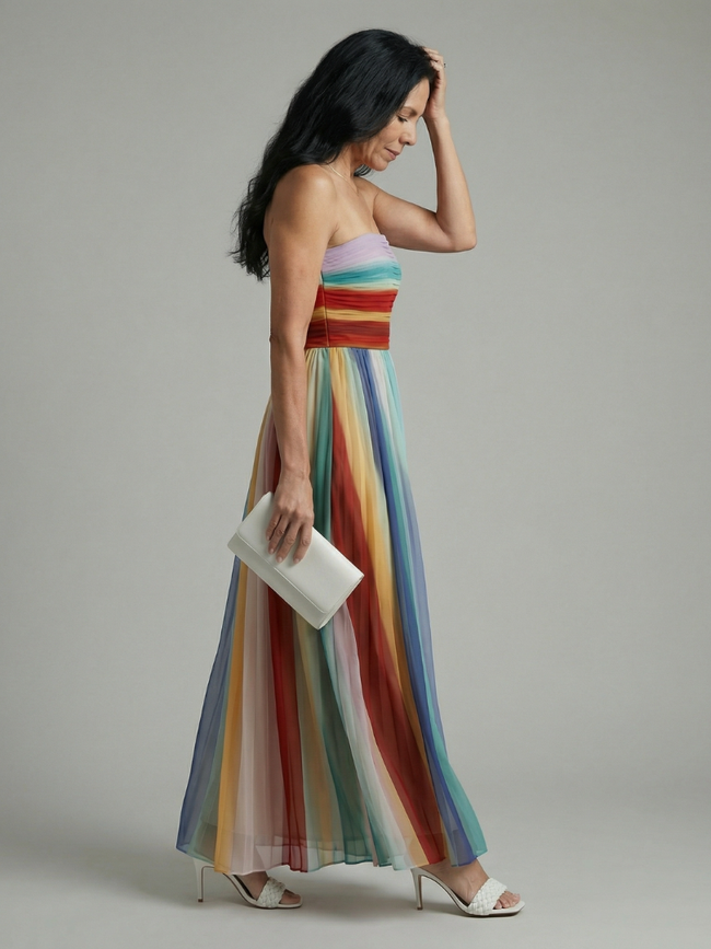 FJØRNA women's summer maxi dress with bold striped pattern, strapless design, flowing fabric, ideal for warm weather and casual wear.
