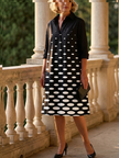 Elegant women's polka dot dress with pockets by FJØRNA, suitable for evening occasions, featuring a stylish and comfortable design.