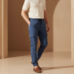 FJØRNA men's cargo trousers with drawstring waist and relaxed fit, casual pant style in neutral color, front and side view.