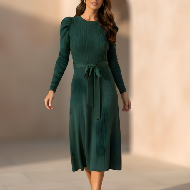 Elegant knitted jumper dress for women by FJØRNA, featuring a cozy, stylish design with a fitted silhouette and textured knit pattern.