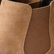 FJØRNA men's slip-on Chelsea boots in black leather, sleek ankle-length shoes with elastic side panels and pull tabs.