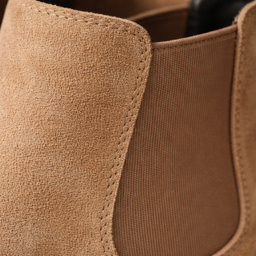 FJØRNA men's slip-on Chelsea boots in black leather, sleek ankle-length shoes with elastic side panels and pull tabs.