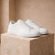 FJØRNA men's leather trainers, stylish casual shoes with black leather uppers and white rubber soles, designed for comfort and durability.