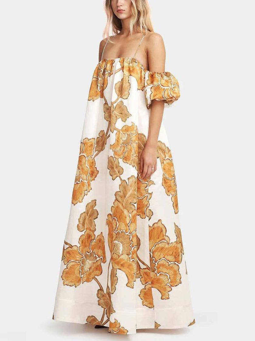 FJØRNA floral print sling dress in mini, midi, or maxi length, featuring a vibrant pattern and adjustable straps for a stylish look.