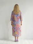 FJØRNA women's summer midi dress with floral print, long sleeves, flowy relaxed fit, perfect for warm weather.