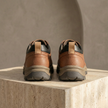 Red leather orthopedic men's shoes by FJØRNA, showcasing a stylish and supportive footwear design for men.