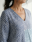 FJØRNA women's summer midi dress with long sleeves, wrap style, flowy fabric, breathable for warm weather.