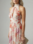 FJØRNA women's floral summer maxi dress with halter neck, sleeveless design and breathable fabric, perfect for warm weather.