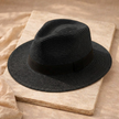 FJØRNA Carolous men's handcrafted classic Panama hat with a wide brim and woven straw design for stylish sun protection.