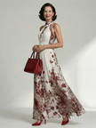FJØRNA floral summer maxi dress for women with long sleeves and pleated design, flowing and lightweight for warm weather.