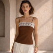 Women’s cotton camisole top with lace trim by FJØRNA, featuring a sleeveless summer design and soft fabric.
