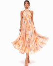 FJØRNA elegant women's maxi dress with print and halter neck, flowing fabric, and stylish design for summer or special occasions.
