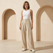 Women’s high waisted wide leg tailored trousers by FJØRNA, featuring a sleek fit and classic design for versatile styling.