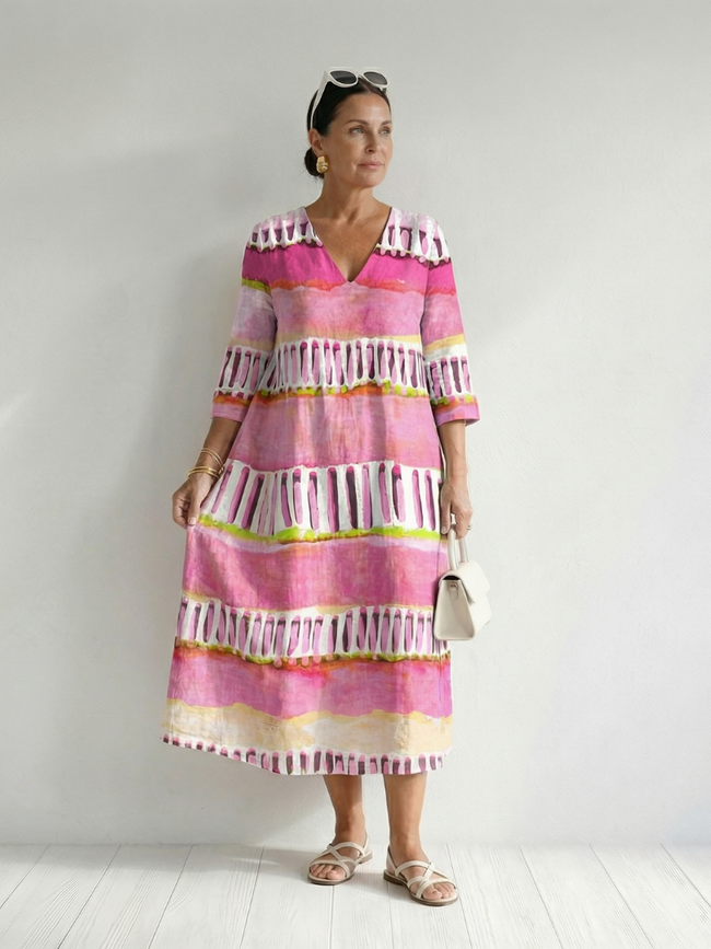 FJØRNA women's summer midi dress with striped pattern, long sleeves, flowy and relaxed fit, perfect for warm weather.
