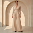 Women’s V neck mesh sleeve evening jumpsuit by FJØRNA, stylish women’s set featuring a V neckline and sheer mesh sleeves.