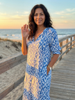 FJØRNA women's summer midi dress with geometric pattern and short sleeves, featuring a wrap design, perfect for warm weather.