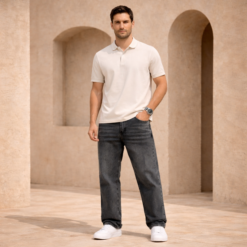 Relaxed fit men's denim jeans by FJØRNA, showing classic blue cotton pants with five-pocket design and casual style.