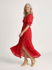 FJØRNA women's floral summer midi dress with square neckline and puff sleeves, perfect for warm-weather occasions.