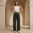 Women’s FJØRNA pinstripe wide-leg trousers, high-waisted pants with a tailored fit, shown in a stylish pinstripe pattern.