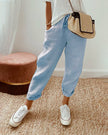 FJØRNA lightweight summer women's trousers with high waist and straight leg design, featuring side pockets.