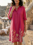 FJØRNA women's summer floral dress with pockets, lightweight and stylish for warm weather, shown on a model.