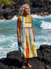 FJØRNA women's sleeveless summer midi dress with wrap design, flowy and breathable fabric, perfect for warm weather.