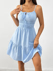 FJØRNA sleeveless white tiered sundress with drawstring detail, lightweight fabric, and flowing design perfect for warm weather.