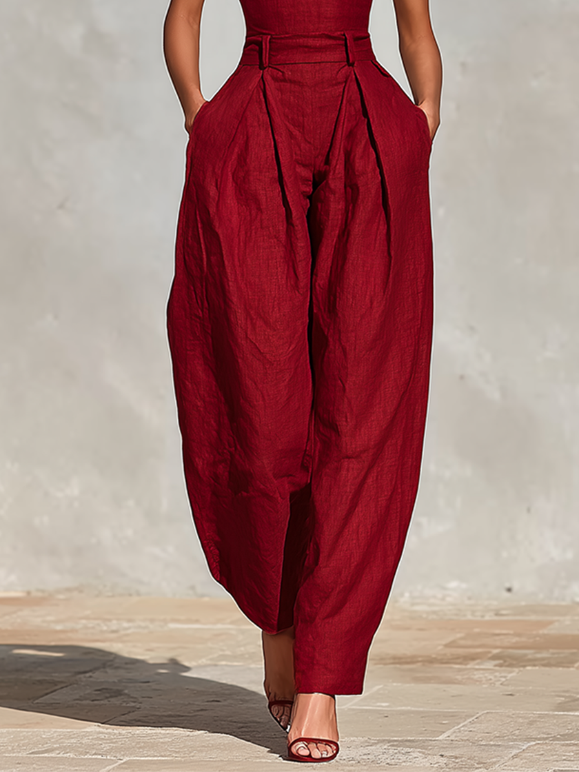 FJØRNA women's linen spaghetti strap jumpsuit with V-neck, high-waisted pleated wide-leg pants, perfect for casual wear.