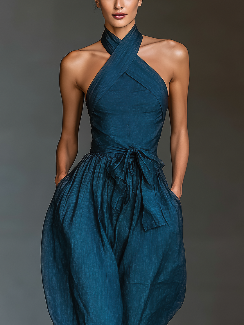 FJØRNA women's linen cross halter jumpsuit with wide-leg pants, tie waist, and side pockets, perfect for casual wear.