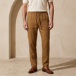FJØRNA men's cotton linen trousers with drawstring, relaxed fit and casual style, shown in natural fabric and neutral color.