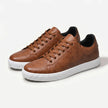 FJØRNA men's leather lace-up low top sneakers showing black leather upper and white rubber sole.