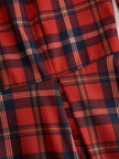 FJØRNA elegant long sleeve plaid dress with a classic and contemporary design, featuring a fitted bodice and stylish pattern.