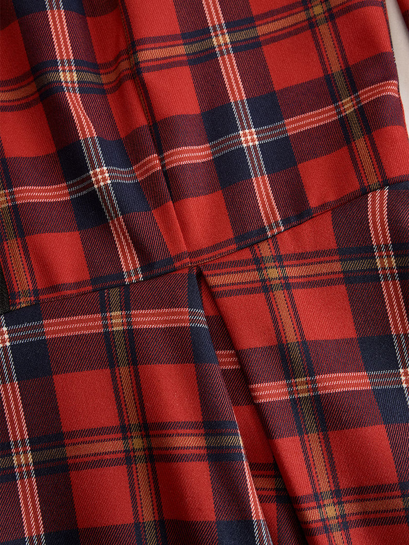 FJØRNA elegant long sleeve plaid dress with a classic and contemporary design, featuring a fitted bodice and stylish pattern.