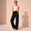 FJØRNA women's lounge trousers with drawstring waist, relaxed fit, soft fabric, suitable for comfortable casual wear.