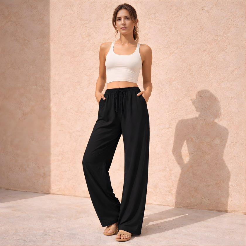 FJØRNA women's lounge trousers with drawstring waist, relaxed fit, soft fabric, suitable for comfortable casual wear.