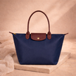 FJØRNA leather tote bag for women, large foldable bag with spacious interior and stylish design, ideal for daily use.