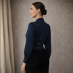 FJØRNA men's satin long sleeve top, showcasing smooth fabric and tailored fit, worn by a model with a neutral background.