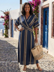 FJØRNA women’s summer midi dress with vertical stripes and V-neck, flowing and lightweight for warm weather.