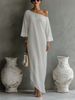Women's ivory white cotton-linen blend mini dress by FJØRNA, showcasing a stylish and breathable summer dress with a fitted silhouette.