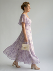 FJØRNA floral summer midi dress for women with square neckline and sleeveless design, featuring a vibrant floral pattern.
