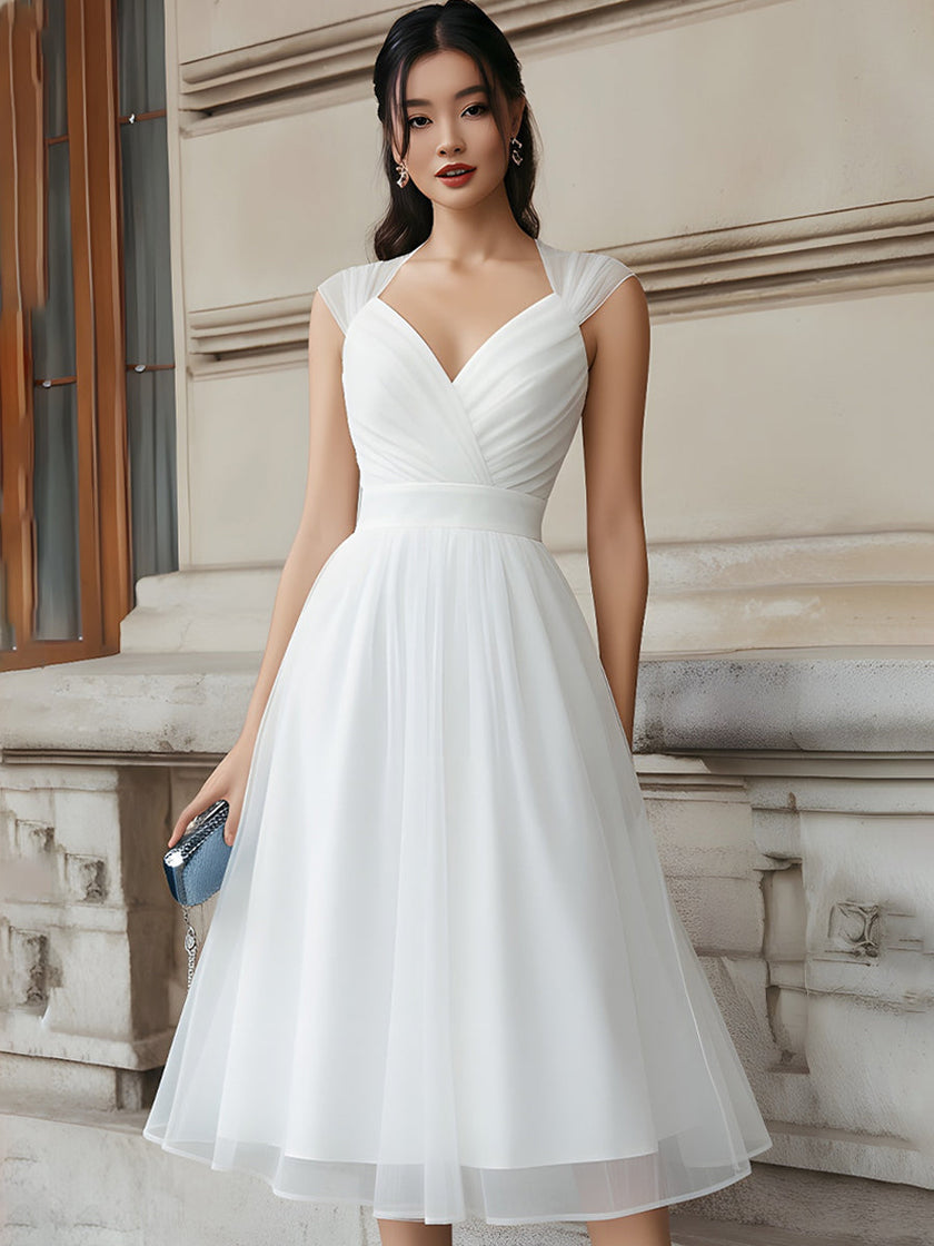 FJØRNA sleeveless v-neck pleated midi dress with cap sleeves, elegant and flowing design, shown on model.