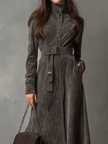FJØRNA high neck belted suede midi dress showing a fitted silhouette with a waist belt and midi length in soft suede fabric.