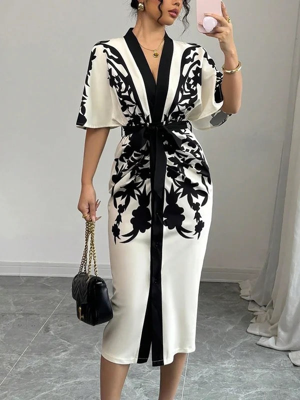 FJØRNA white midi dress with half sleeves, floral print, v-neck, and tied waist, perfect for casual or summer wear.