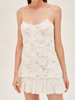 FJØRNA Blanc Rosette-Detailed Georgette Mini Dress with delicate rosette accents and flowy fabric, perfect for elegant occasions.