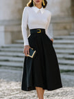 FJØRNA pleated A-line midi skirt with statement buckle belt, stylish dress for women, showcasing the flowy fabric and fashionable design.