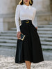 FJØRNA pleated A-line midi skirt with statement buckle belt, stylish dress for women, showcasing the flowy fabric and fashionable design.