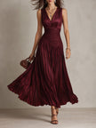 FJØRNA satin striped maxi dress with elegant evening design, featuring flowing fabric and contrasting stripe pattern.