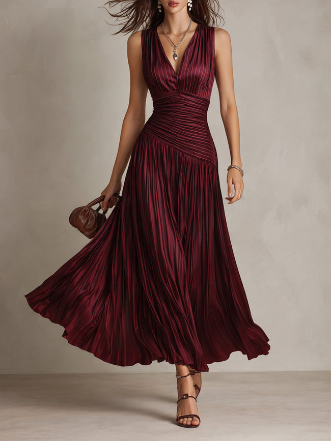 FJØRNA satin striped maxi dress with elegant evening design, featuring flowing fabric and contrasting stripe pattern.