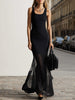 Black sheer mesh mermaid maxi dress by FJØRNA, flowing silhouette with intricate lace details and elegant long sleeves.